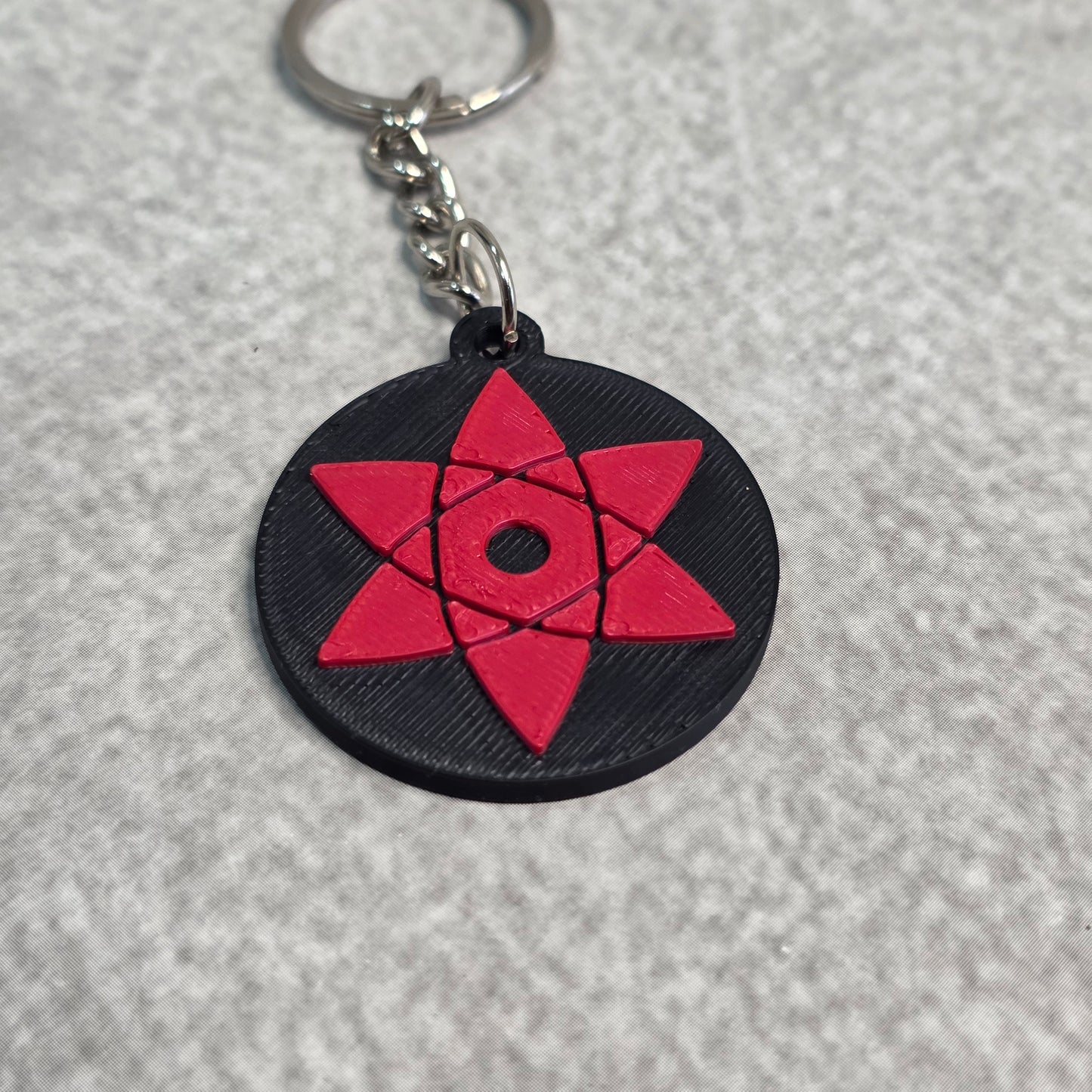 Sasuke Uchiha Mangekyou Sharingan Keychain | Two Tone Naruto Keyring
